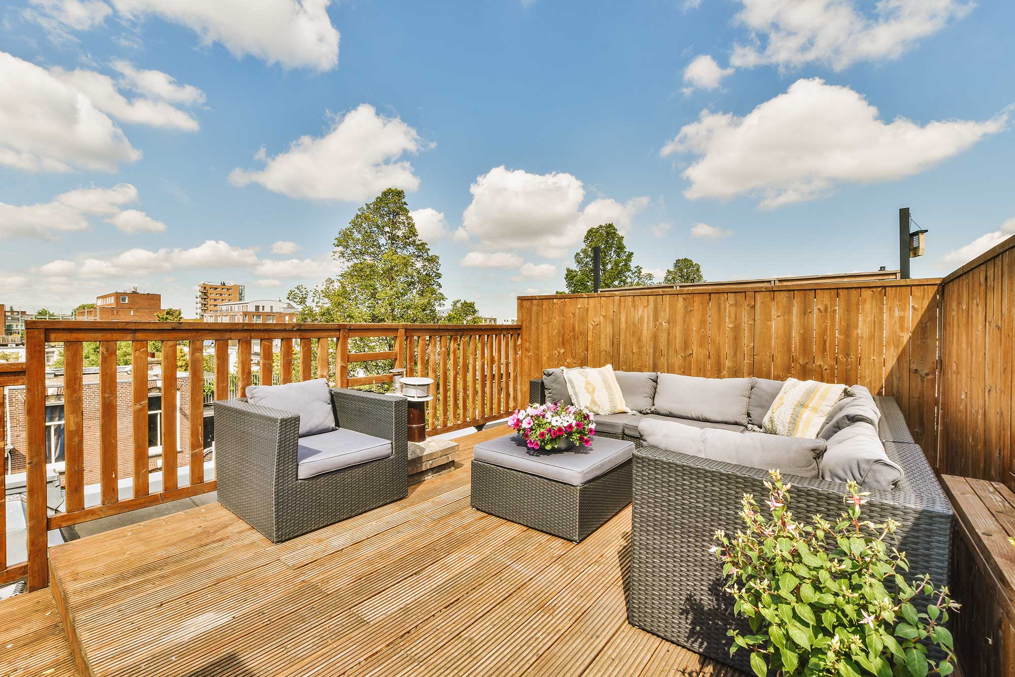 Rooftop composite deck with privacy fencing overlooking the neighborhood.