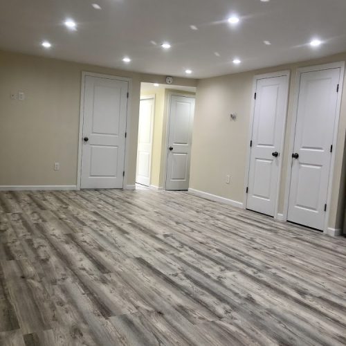 A clean, empty room featuring polished wood floors, creating a spacious and inviting atmosphere.